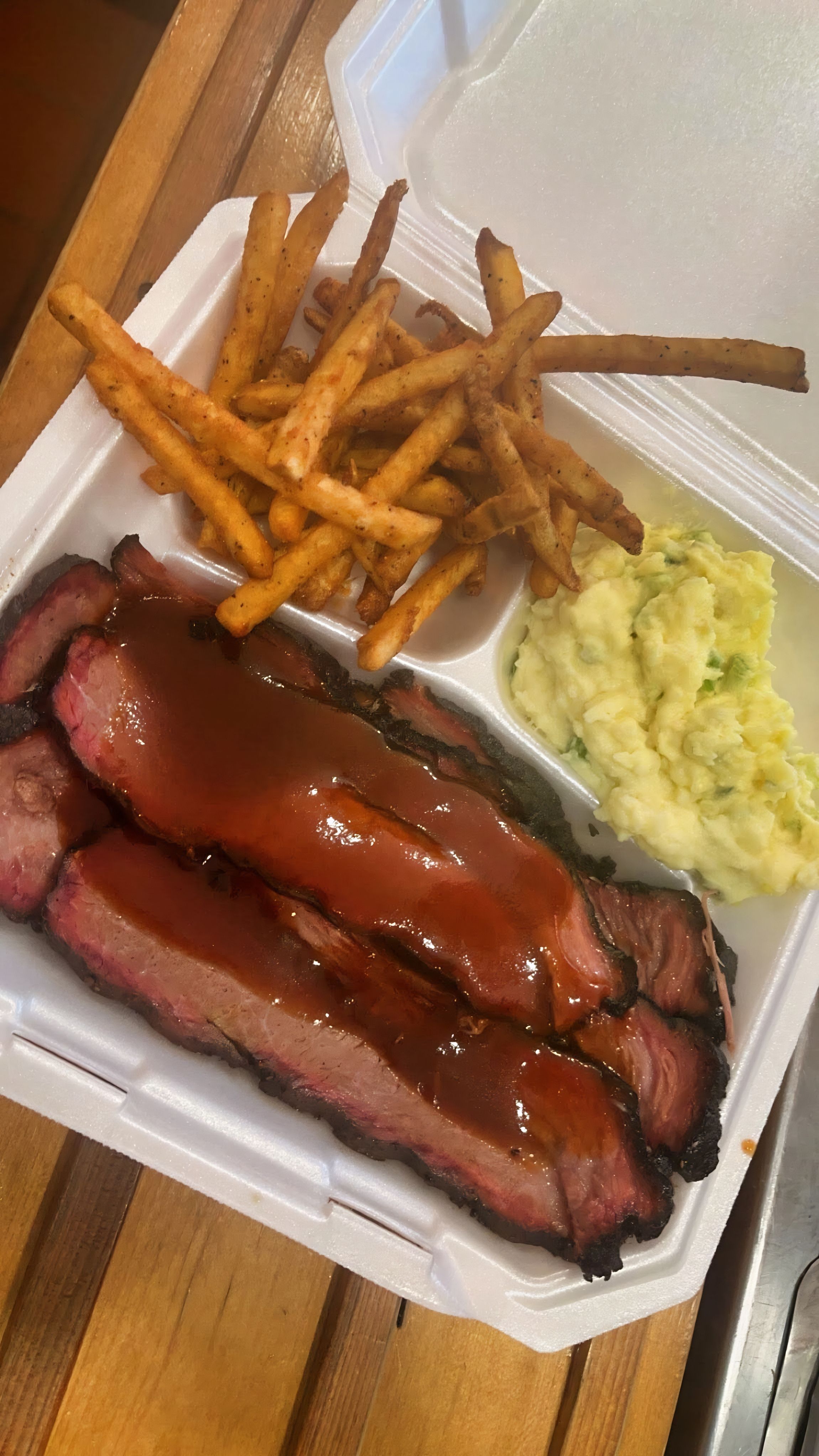 Firehawk Smokehouse smoked brisket plate with fries and potato salad