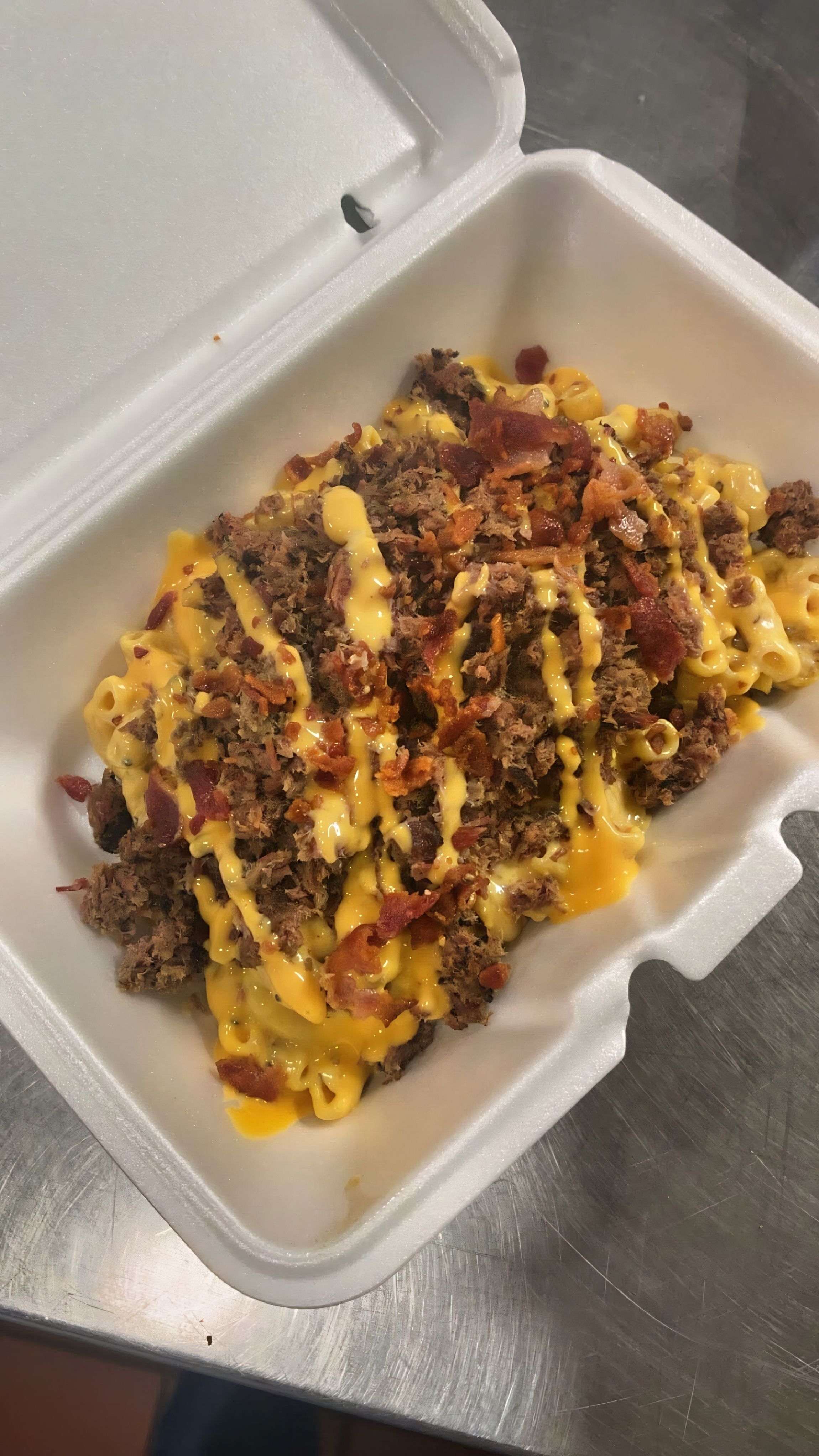 Firehawk Smokehouse loaded mac and cheese with smoked brisket and bacon